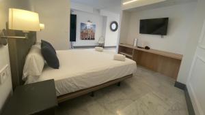 Ένα ή περισσότερα κρεβάτια σε δωμάτιο στο LININ FRANCOS