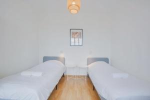 מיטה או מיטות בחדר ב-T3 charmant 4* 65m² Parking @ Thermal / Artem