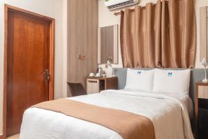 Marlin All Inclusive Resort tesisinde bir odada yatak veya yataklar