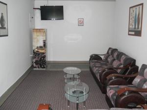 Telewizja i/lub zestaw kina domowego w obiekcie Garni hotel Alma