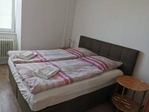 a bed with two pillows on it in a room at Ferienwohnung 305 am Kasinopark in Georgsmarienhütte +10 photos