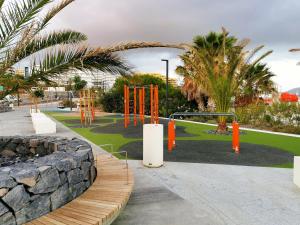 A garden outside Strelitzia Apartment - ocean view & heated pool
