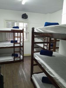 a group of bunk beds in a room at Casa da Vila Hostel Guest House in São Paulo