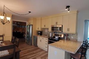 A kitchen or kitchenette at Lochaber Lakeview Cottage