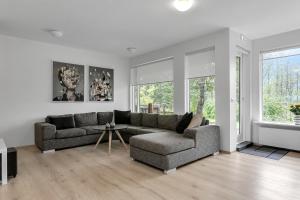 a living room with a couch and a table at Villa - South Iceland in Laugaras