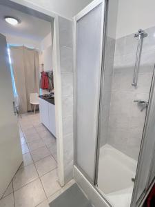 a shower with a glass door in a bathroom at Vienna Prater Apartments in Vienna