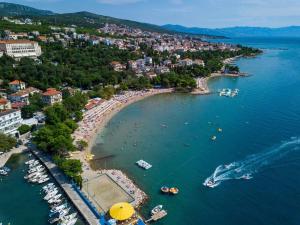 an aerial view of a beach with boats in the water at Apartments in Crikvenica 41681 in Crikvenica