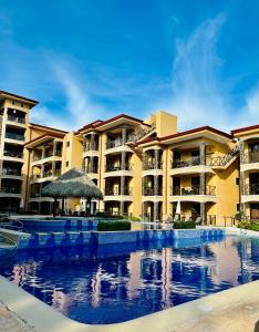 Bazén v ubytování Apartamento de Lujo en Playa Jacó, Frente al Mar, Wifi, AC, Parqueo Privado y Piscinas nebo v jeho okolí