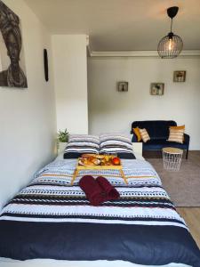 a bedroom with a large bed with fruit on it at Peaceful cocoon in Chatou
