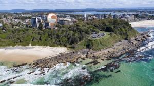 an aerial view of a beach and the ocean at Oceancrest 4 in Forster