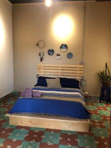 Krevet ili kreveti u jedinici u okviru objekta Hostal Casa Gaia