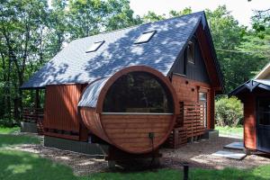 a tiny house with a gambrel roof at LEVATA in Nasu