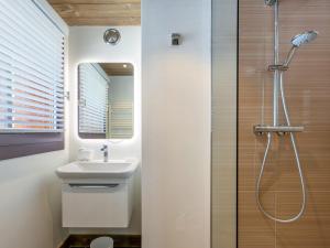 a bathroom with a sink and a shower at Appartement de prestige avec cheminée, balcon et wifi à Val-d'Isère - FR-1-694-320 in Val dʼIsère +13 photos
