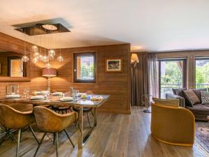 a dining room with a table and chairs at Appartement de standing avec balcon ensoleillé, 3 chambres, au cœur de Val-d'Isère - FR-1-694-322 in Val dʼIsère