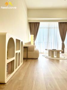 a living room with a couch and a table at Costa Mahkota Suites Malacca Central By Nestcove in Melaka