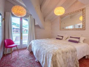 a bedroom with a bed and a mirror and a chair at Prestige et luxe au cœur de Val-d'Isère, proche des pistes - FR-1-694-323 in Val dʼIsère