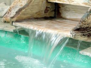 a waterfall in the middle of a pool of water at 志摩半島 Shima Hanto in Shima +13 photos