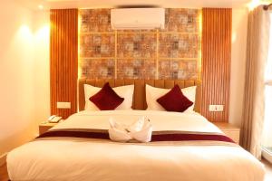 Voodi või voodid majutusasutuse Hotel Elegant Kathmandu Inn toas