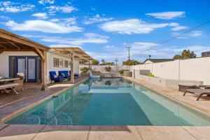 a swimming pool in the backyard of a house at Relaxing Old Town Scottsdale desert oasis awaits in Scottsdale