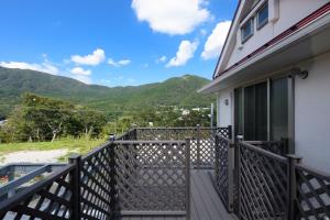 a balcony with a view of the mountains at 和光荘 Harmonious Light West in Hakone