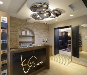 a hair salon with a chandelier and a hair at Hotel Trevi - Gruppo Trevi Hotels in Rome