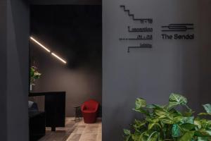 a room with some plants and a stair case at The Sendal Boutique Hotel in Nicosia