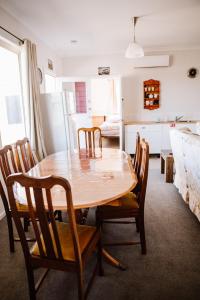 a kitchen and dining room with a wooden table and chairs at True Blue Five - The Residence in Sheffield