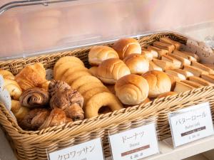 a basket filled with lots of different types of pastries at Vessel Hotel Fukuyama in Fukuyama