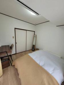 Postel nebo postele na pokoji v ubytování atami kawaneso onsen in shizuoka
