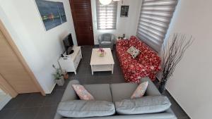 an overhead view of a living room with a couch at Relaxing Avra Villa in Paralimni
