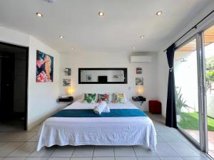 Ένα ή περισσότερα κρεβάτια σε δωμάτιο στο Ocean Lovers Hostel & Apartments
