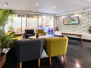 a waiting room with chairs and a table at Stay Hotel Waikiki in Honolulu