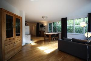 a living room with a couch and a table at Konstanzer Ferienwohnungen in Konstanz