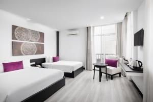 Postel nebo postele na pokoji v ubytování Apsor Palace Hotel