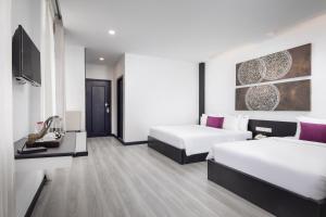 Postel nebo postele na pokoji v ubytování Apsor Palace Hotel