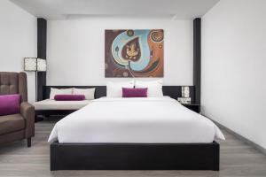 Postel nebo postele na pokoji v ubytování Apsor Palace Hotel