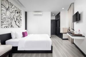 Postel nebo postele na pokoji v ubytování Apsor Palace Hotel