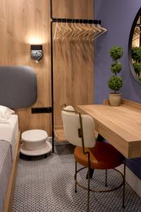 a room with a bed and a desk and a chair at XANTHI POLIS CITY CENTER with private parking in Xanthi