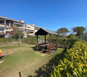 a park with a picnic table and a gazebo at Green Residence - Apartment with Private Garden in Desenzano del Garda