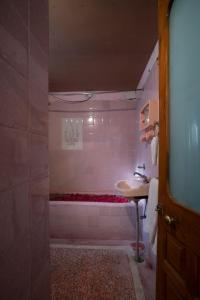 a bathroom with a sink and a bath tub at Hotel Ambavgarh Palace in Udaipur +57 photos
