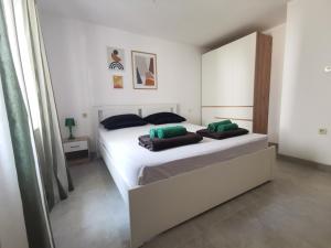 Postel nebo postele na pokoji v ubytování Apartments Silver