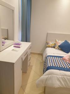 A bed or beds in a room at Sharm Hills