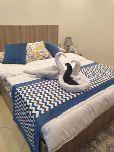 A bed or beds in a room at Sharm Hills