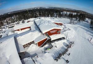 an aerial view of a building covered in snow at Hassela Ski Resort in Hassela