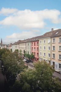 a view of a city with buildings and trees at Spacious apartment next to Rhine in Basel