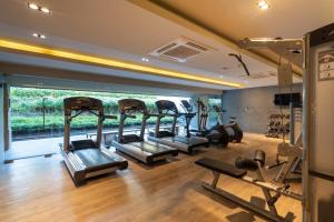 a gym with several treadmills and cardio machines at Baan MaiKhao by CHIWA in Mai Khao Beach