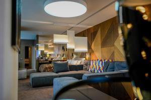 a living room with a couch and a bed at Yaremche Club Hotel in Yaremche