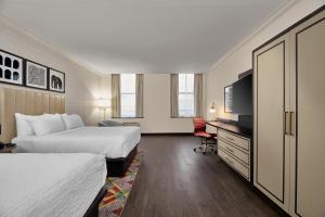 Postel nebo postele na pokoji v ubytování Hotel Indigo Cleveland Downtown by IHG