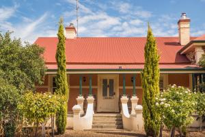 a house with a red roof and trees at Barossa Shiraz Estate in Lyndoch