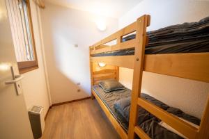 a bunk bed room with two bunk beds in it at Résidence Capfun du Téléphérique, Morzine in Morzine +11 photos